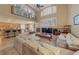 Spacious living room with fireplace and large windows offering plenty of natural light at 11275 Gammila Dr, Las Vegas, NV 89141