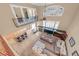 Open-concept living area features a fireplace, vaulted ceilings, and a breakfast bar with kitchen view at 11275 Gammila Dr, Las Vegas, NV 89141