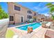Backyard oasis with a sparkling pool, tiled patio, and inviting lounge area perfect for outdoor entertaining at 11275 Gammila Dr, Las Vegas, NV 89141