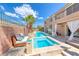 Beautiful backyard showcasing a pool, spa, and lounge area, perfect for outdoor relaxation and entertaining at 11275 Gammila Dr, Las Vegas, NV 89141