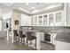 Stylish bar area with ample storage, modern appliances, and convenient access from the living area, perfect for entertaining at 12217 Tempestad Ave, Las Vegas, NV 89138