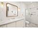 Bathroom featuring white cabinetry, stone countertops, and a glass shower at 12217 Tempestad Ave, Las Vegas, NV 89138