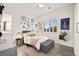 Bedroom with a window, bed, dresser, and modern decor at 12217 Tempestad Ave, Las Vegas, NV 89138
