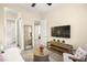 A beautifully decorated bedroom with neutral tones, a daybed, and a ceiling fan at 12217 Tempestad Ave, Las Vegas, NV 89138