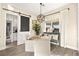 Cozy breakfast nook with designer lighting and a sliding barn door adds charm and functionality at 12217 Tempestad Ave, Las Vegas, NV 89138