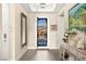 Entryway featuring decorative iron gate and adjacent console table at 12217 Tempestad Ave, Las Vegas, NV 89138