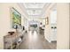 Hallway showcasing open-concept living space and coffered ceilings at 12217 Tempestad Ave, Las Vegas, NV 89138