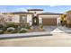 Inviting home with manicured landscaping and paved driveway at 12217 Tempestad Ave, Las Vegas, NV 89138