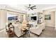 A modern and elegant living room boasts sliding doors to the outdoor space and built-in shelving at 12217 Tempestad Ave, Las Vegas, NV 89138