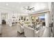 Open floor plan with kitchen, dining, and living spaces featuring recessed lighting, hardwood floors, and mountain views at 12217 Tempestad Ave, Las Vegas, NV 89138