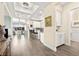 Open living space with hardwood floors and views of the kitchen and patio, creating an inviting atmosphere at 12217 Tempestad Ave, Las Vegas, NV 89138