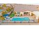 Inviting backyard features a pristine pool, lounge area, and covered patio ideal for entertaining at 12217 Tempestad Ave, Las Vegas, NV 89138