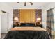 Stunning main bedroom featuring a unique headboard design, elegant lamps, and stylish decor at 12648 Heritage Bend Dr, Las Vegas, NV 89138