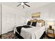 This cozy bedroom features a ceiling fan, soft textures, and ample closet space at 12648 Heritage Bend Dr, Las Vegas, NV 89138