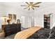 Bright bedroom with stylish decor, ceiling fan, and well-organized walk-in closet at 12648 Heritage Bend Dr, Las Vegas, NV 89138