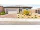 Charming single-Gathering home with a brick driveway and manicured desert landscaping at 12648 Heritage Bend Dr, Las Vegas, NV 89138
