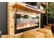 Close up of an electric fireplace that is surrounded by wood planks, with a mantle and decor at 12648 Heritage Bend Dr, Las Vegas, NV 89138