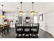 Stylish kitchen features white cabinets, stainless steel appliances, pendant lighting, and modern island seating at 12648 Heritage Bend Dr, Las Vegas, NV 89138