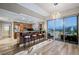 Open kitchen with stainless appliances, island seating, and city views through floor-to-ceiling windows at 150 Las Vegas Blvd # 1507, Las Vegas, NV 89101