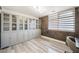 Bright office with floor to ceiling bookshelves and modern window shades, perfect for work from home at 150 Las Vegas Blvd # 1507, Las Vegas, NV 89101