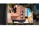 Aerial view of backyard featuring a kidney-shaped pool, covered patio, and desert landscaping at 1528 Tonada Way, Las Vegas, NV 89117