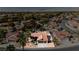Aerial view of a home with a well-maintained exterior, driveway, desert landscaping, and surrounding neighborhood at 1528 Tonada Way, Las Vegas, NV 89117