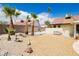 Backyard features desert landscaping, mature trees, and seating area for outdoor relaxation and enjoyment at 1528 Tonada Way, Las Vegas, NV 89117