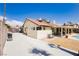 Exterior view of property with long driveway and backyard retreat at 1528 Tonada Way, Las Vegas, NV 89117