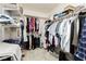 Spacious walk-in closet with clothing racks, shelves, and ample storage space at 1528 Tonada Way, Las Vegas, NV 89117