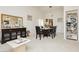 Open concept dining room with neutral decor and access to kitchen; perfect for entertaining at 1528 Tonada Way, Las Vegas, NV 89117