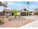 Charming single-story home featuring a well-manicured yard and two-car garage at 1528 Tonada Way, Las Vegas, NV 89117