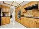 Functional kitchen features wood cabinetry and stainless steel appliances at 1528 Tonada Way, Las Vegas, NV 89117