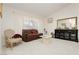Inviting living room with plush seating, elegant decor, and large windows for natural light at 1528 Tonada Way, Las Vegas, NV 89117