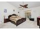 Bedroom featuring a ceiling fan, and sliding glass doors leading to the backyard pool area at 1528 Tonada Way, Las Vegas, NV 89117