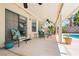 Spacious covered patio with comfortable seating and ceiling fans at 1528 Tonada Way, Las Vegas, NV 89117