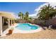 Sparkling pool surrounded by palm trees, creating a relaxing backyard oasis at 1528 Tonada Way, Las Vegas, NV 89117