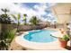 Backyard pool and deck, complimented with mature landscaping at 1528 Tonada Way, Las Vegas, NV 89117