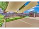 Backyard shed with artificial turf and awning at 1676 Divinity St, Las Vegas, NV 89142