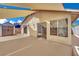 Spacious backyard with partial cover, shed, and block fencing at 1676 Divinity St, Las Vegas, NV 89142