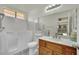 Bathroom featuring a walk-in bathtub, tile floor, and a large mirror at 1676 Divinity St, Las Vegas, NV 89142