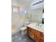 Modern bathroom with walk-in tub, vanity, and updated fixtures at 1676 Divinity St, Las Vegas, NV 89142