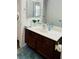 Bathroom with modern vanity, mirror, and fixtures at 1676 Divinity St, Las Vegas, NV 89142
