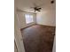 Simple bedroom with ceiling fan and natural light from the window at 1676 Divinity St, Las Vegas, NV 89142