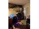 Cozy bedroom with ample storage shelves and an organized closet, offering practical living space at 1676 Divinity St, Las Vegas, NV 89142
