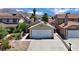 Charming single-story home with an attached garage and a well-maintained front yard in a suburban setting at 1676 Divinity St, Las Vegas, NV 89142