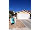 Inviting single-story home with a two-car garage and mature landscaping at 1676 Divinity St, Las Vegas, NV 89142