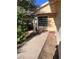 Inviting front porch with a large window, creating a warm and welcoming entrance to the home at 1676 Divinity St, Las Vegas, NV 89142