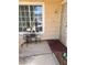 Inviting front porch with seating, a security door, and a large window, creating a warm welcome to the home at 1676 Divinity St, Las Vegas, NV 89142