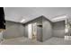 View of the two-car garage with door to living area and water heater at 1676 Divinity St, Las Vegas, NV 89142