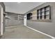 Spacious garage with shelving storage and freshly painted at 1676 Divinity St, Las Vegas, NV 89142